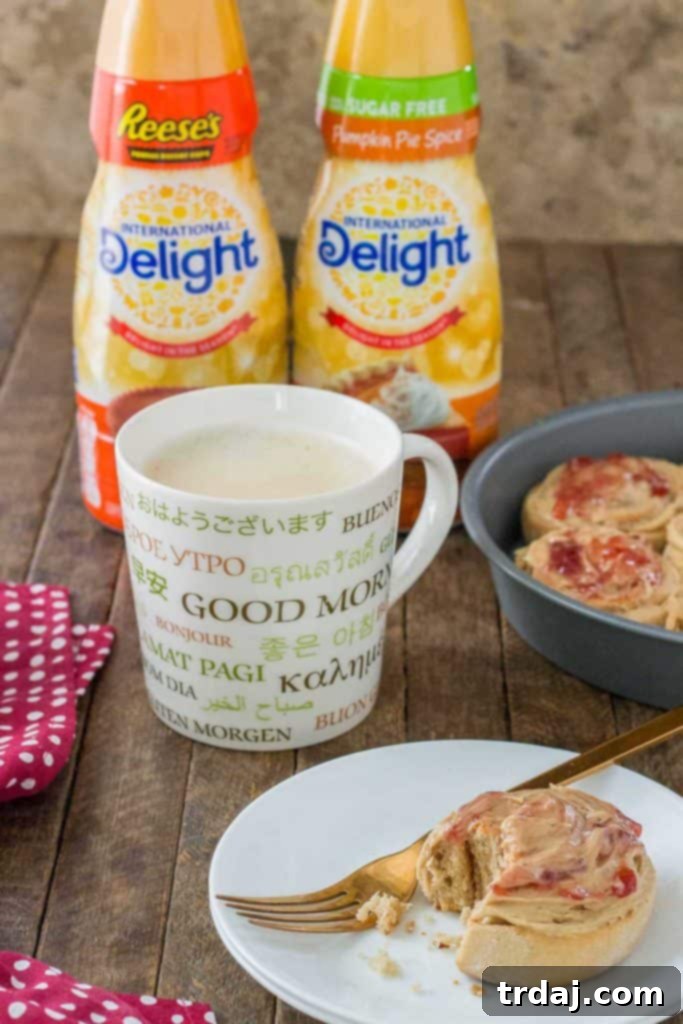 A steaming cup of coffee with a swirl of International Delight creamer, inviting and warm, symbolizing delightful moments. | Strawberry Blondie Kitchen