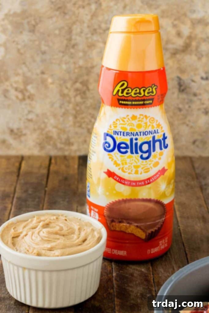 Freshly baked Peanut Butter and Jelly Breakfast rolls, warm from the oven and glistening with sweet peanut butter frosting. | Strawberry Blondie Kitchen