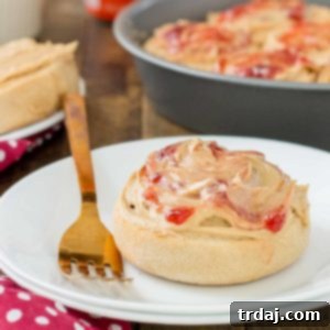 Peanut Butter and Jelly Breakfast Rolls are stuffed with jelly and topped with a delicious peanut butter frosting! The best breakfast roll yet!