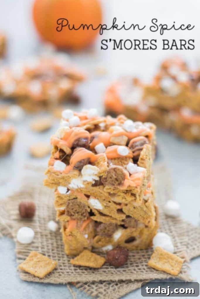 Autumn Pumpkin Spice Smores Bars 3 A stack of delightful Pumpkin Spice S'mores Bars, showcasing their layers of flavor and enticing texture, ready for enjoyment | Strawberry Blondie Kitchen