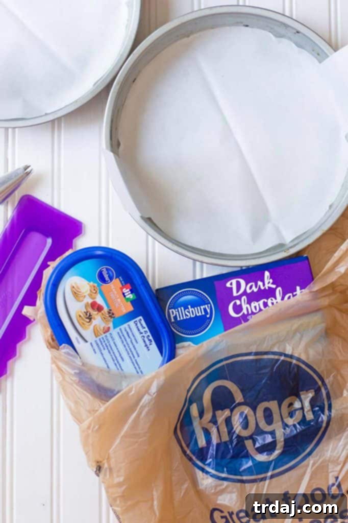 Rich chocolate espresso cakes are layered with Pillsbury™ Peanut Butter Frosting made with real Jif® Peanut Butter to create this Peanut Butter Espresso Cake which is the ultimate cake lover’s dream! | Strawberry Blondie Kitchen