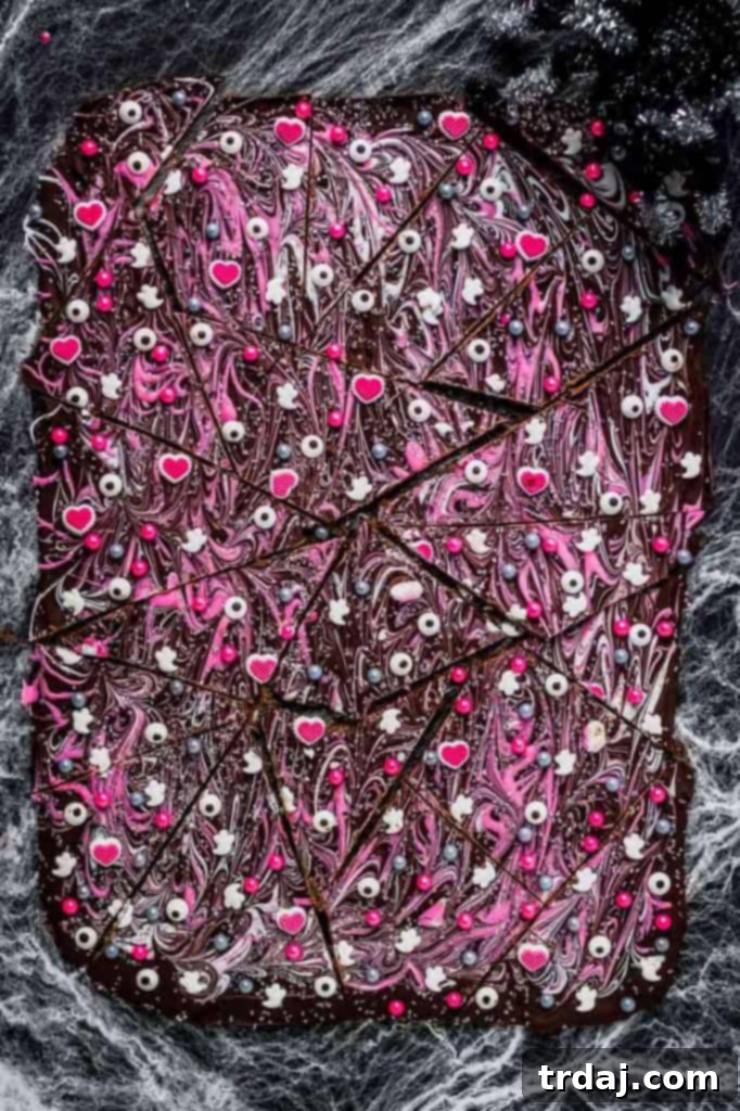 Pink-O-Ween Candy Bark: A Shimmering Halloween Treat Super pretty and sparkly Halloween colors such as pink, silver and black make this Pink-O-Ween Candy Bark fun and creative. Share it with the pink lover in your life!