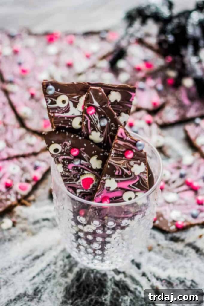 Creative Pink, Silver, and Black Halloween Candy Bark Pink, silver and black candy bark for a fun and creative Halloween celebration.