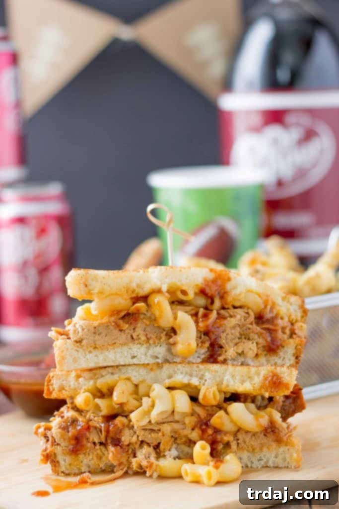 These Dr Pepper Pulled Pork n Mac Sandwiches are a combination of sweet, sharp and tangy. They’re amazing for to feed a crowd on game day, just bring extra napkins.  | Strawberry Blondie Kitchen