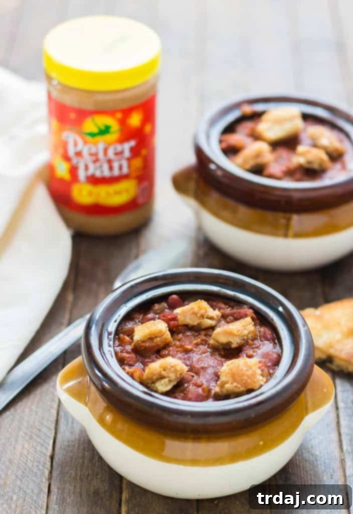 Delicious Crockpot Chili topped with crispy, golden brown peanut butter sandwich croutons