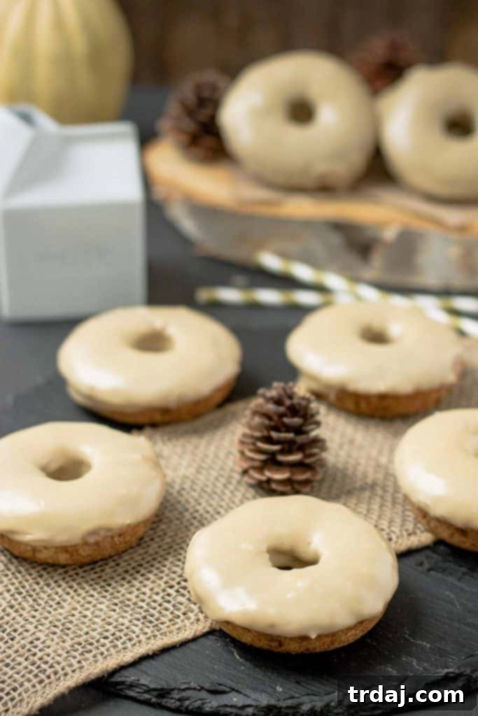 Close-up of baked Apple Cider Donuts with a luxurious Maple Frosting. | Strawberry Blondie Kitchen