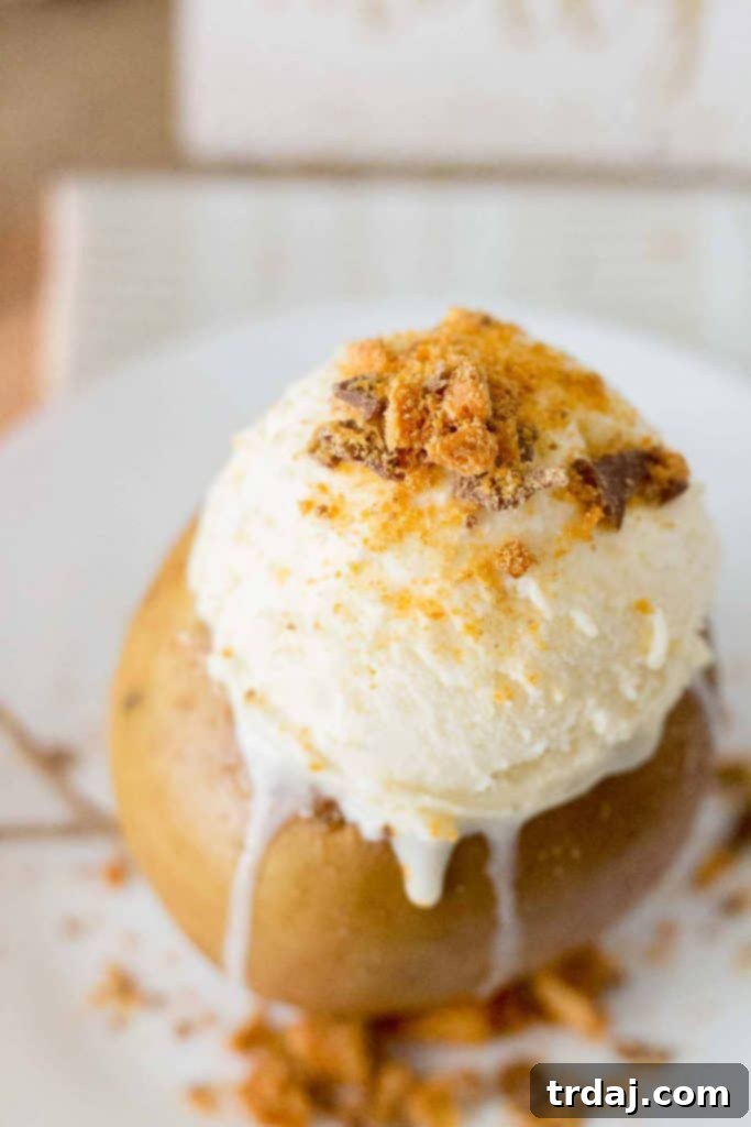 Close-up of Slow Cooker Butterfinger Stuffed Apples on a rustic Friendsgiving table