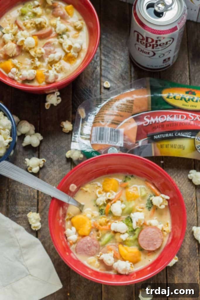 Smoked Sausage and Beer Cheese Soup in a serving bowl with fresh parsley
