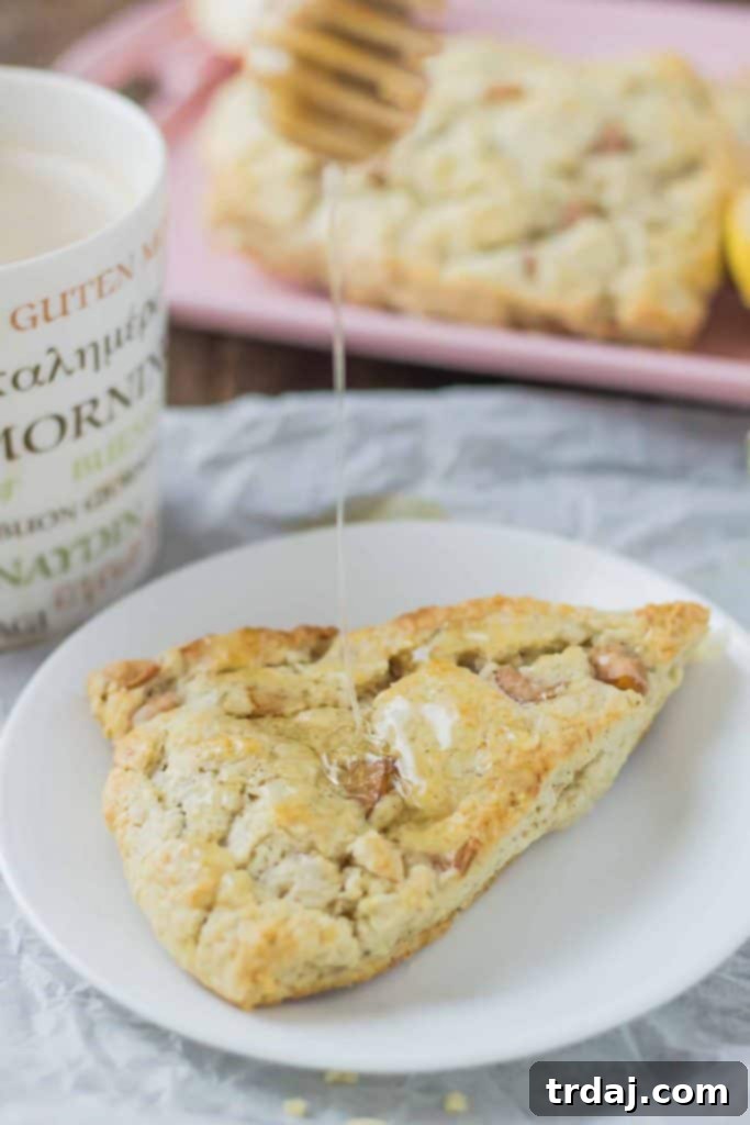 Soft and sweet, with pillows of pear and rich blue cheese and a drizzle of honey, these Pear and Blue Cheese Scones are the perfect pair with your morning cup of coffee! | Strawberry Blondie Kitchen