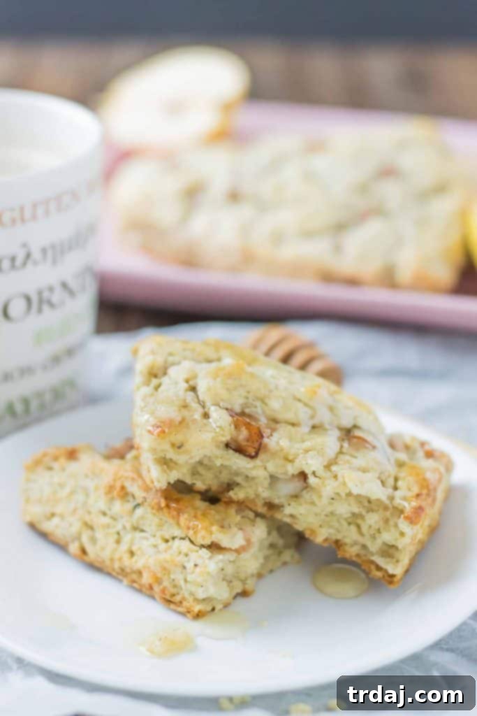 Soft and sweet, with pillows of pear and rich blue cheese and a drizzle of honey, these Pear and Blue Cheese Scones are the perfect pair with your morning cup of coffee! | Strawberry Blondie Kitchen
