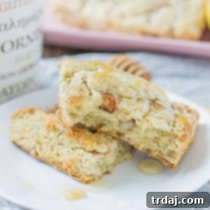 Soft and sweet, with pillows of pear and rich blue cheese and a drizzle of honey, these Pear and Blue Cheese Scones are the perfect pair with your morning cup of coffee! | Strawberry Blondie Kitchen