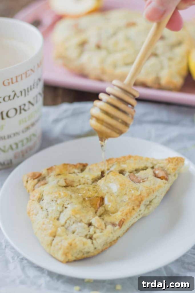 Soft and sweet, with pillows of pear and rich blue cheese and a drizzle of honey, these Pear and Blue Cheese Scones are the perfect pair with your morning cup of coffee! | Strawberry Blondie Kitchen
