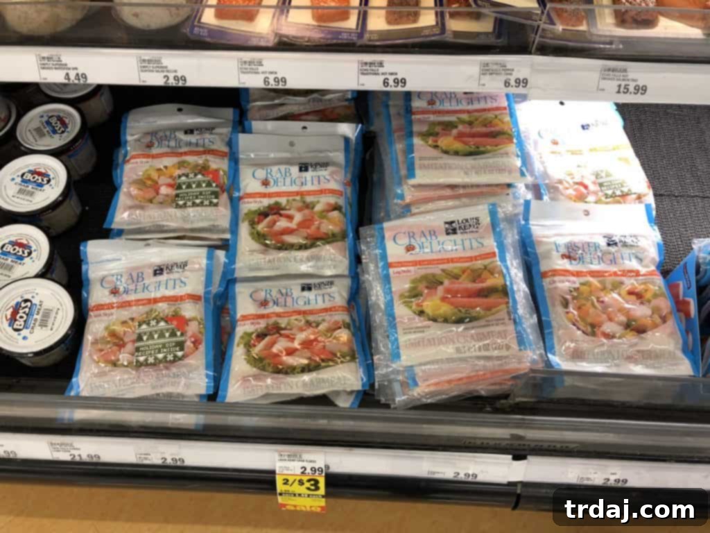 Louis Kemp Crab Delights package displayed alongside a variety of fresh herbs, cream cheese, and everything bagel seasoning for the cheese ball recipe.