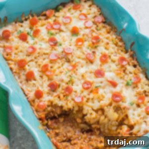 An awesome twist on a classic, this Pizza Shepherd's Pie combines sausage, pepperoni, cheese and hash brown potatoes to give you a hearty casserole worth devouring. | Strawberry Blondie Kitchen
