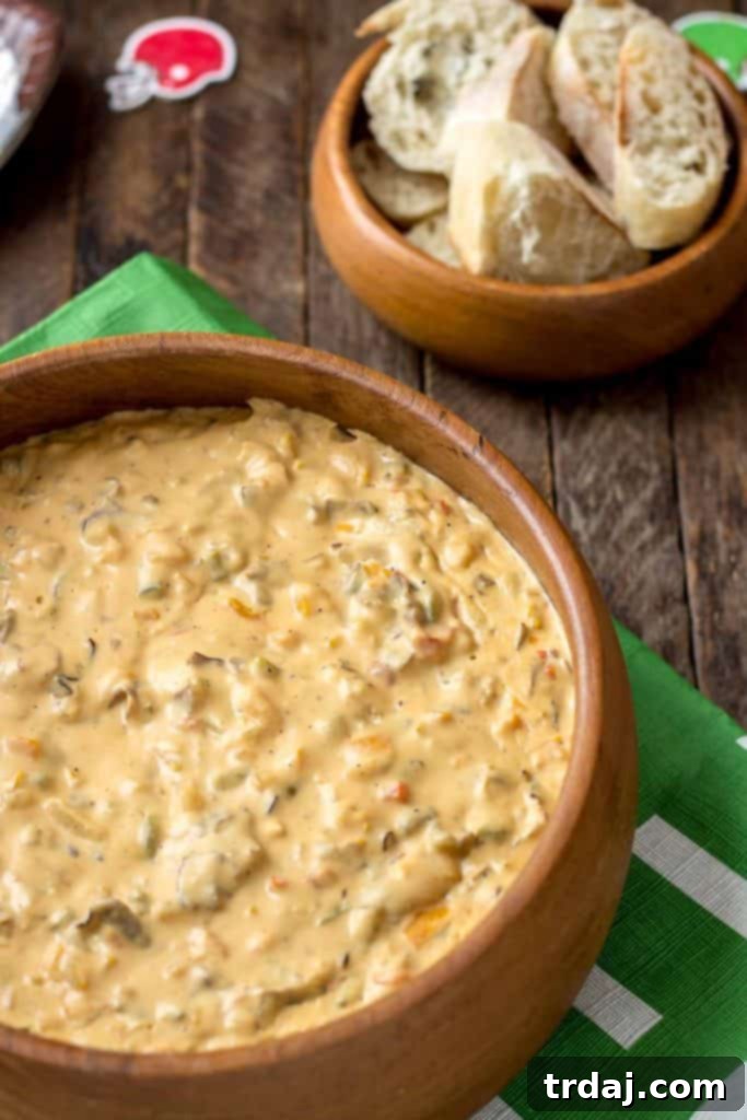 Creamy Slow Cooker Philly Cheesesteak Dip with Baguette Slices for Game Day