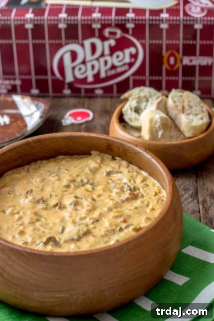 Hearty Slow Cooker Philly Cheesesteak Dip with melted cheese and roast beef