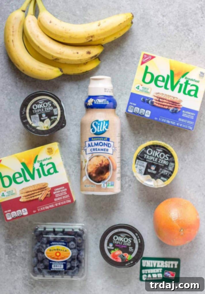 Two mini breakfast pizzas on belVita biscuits, topped with yogurt and fresh berries, ready to eat.