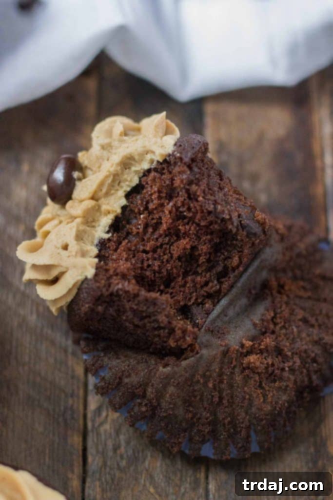 A perfectly piped Peanut Butter Mocha Cupcake, close up detail.