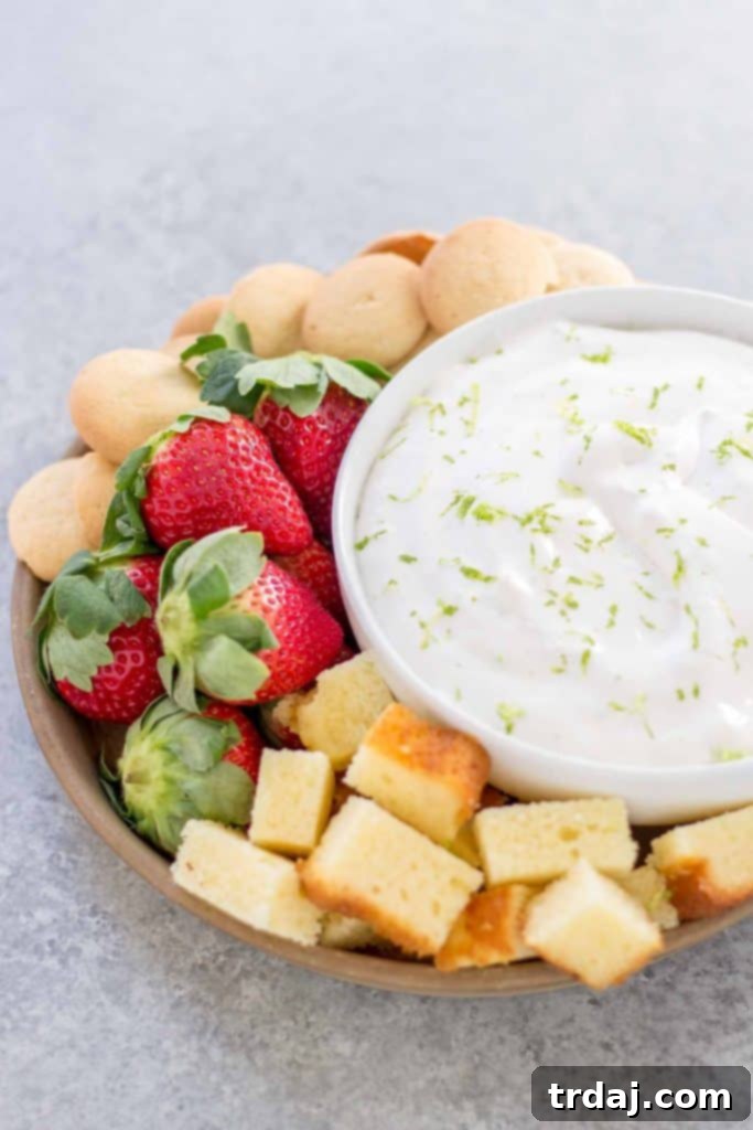 Creamy Key Lime Pie Dip in a serving bowl, garnished with lime zest