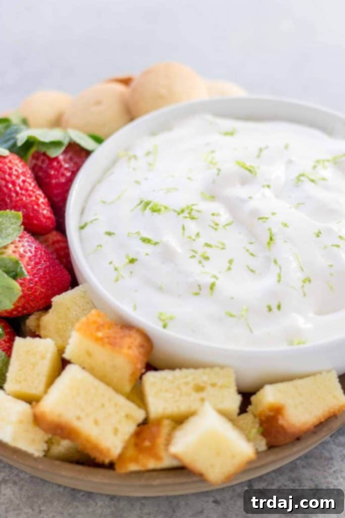 Key Lime Pie Dip served with various dippers like graham crackers and fruit