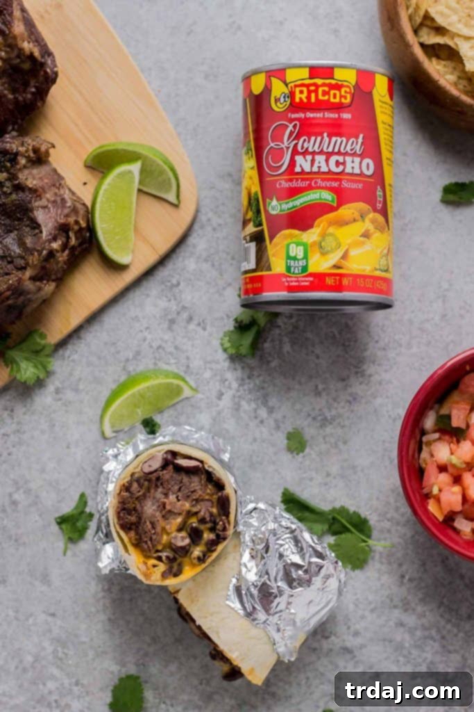 A spread of Braised Beef Nacho Burritos and other Mexican dishes
