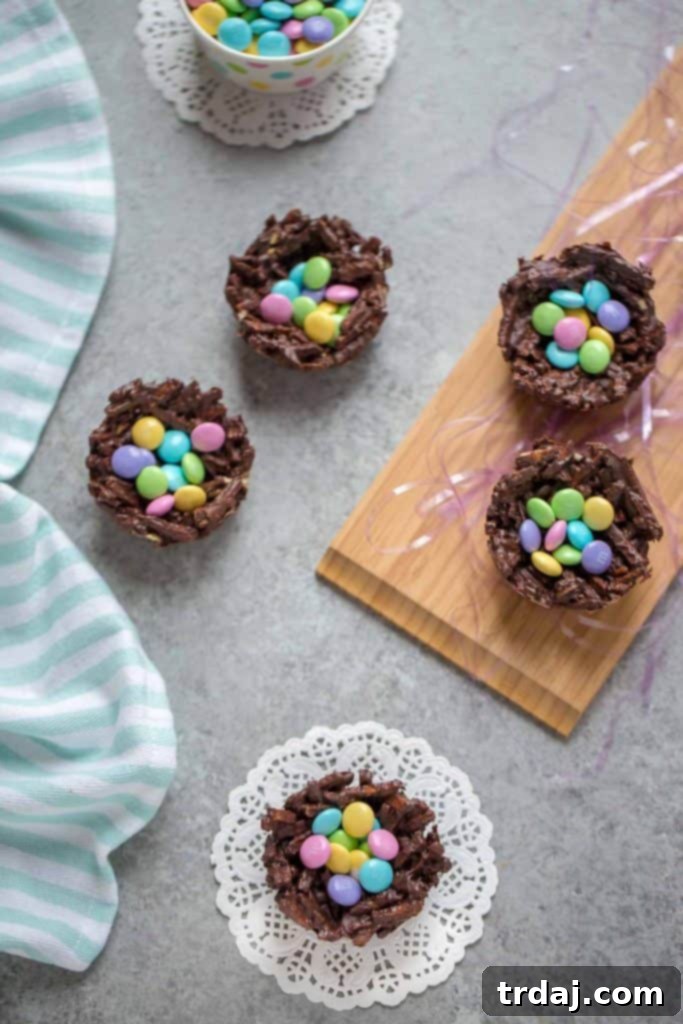 Delicious 2-Ingredient Chocolate Nest Cups filled with festive M&M's, perfect for Easter and spring parties.