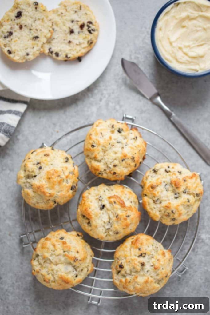 Assortment of Irish Soda Bread Scones on a wooden board with fresh oranges