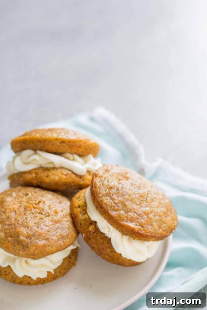 Close-up of a filled Carrot Cake Whoopie Pie, showcasing the creamy frosting
