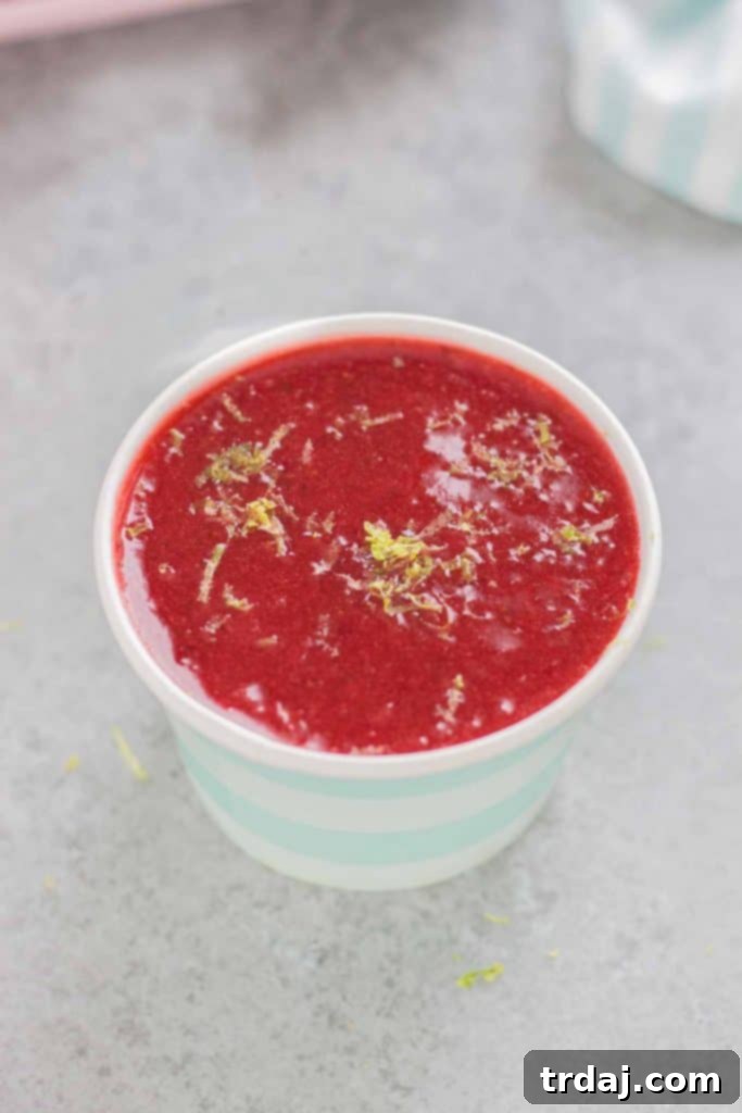 Homemade Soft Pretzels with Strawberry Margarita Sauce Close-up shot of Golden Homemade Soft Pretzels alongside a bowl of luscious Strawberry Margarita Sauce, highlighting the texture and appeal.