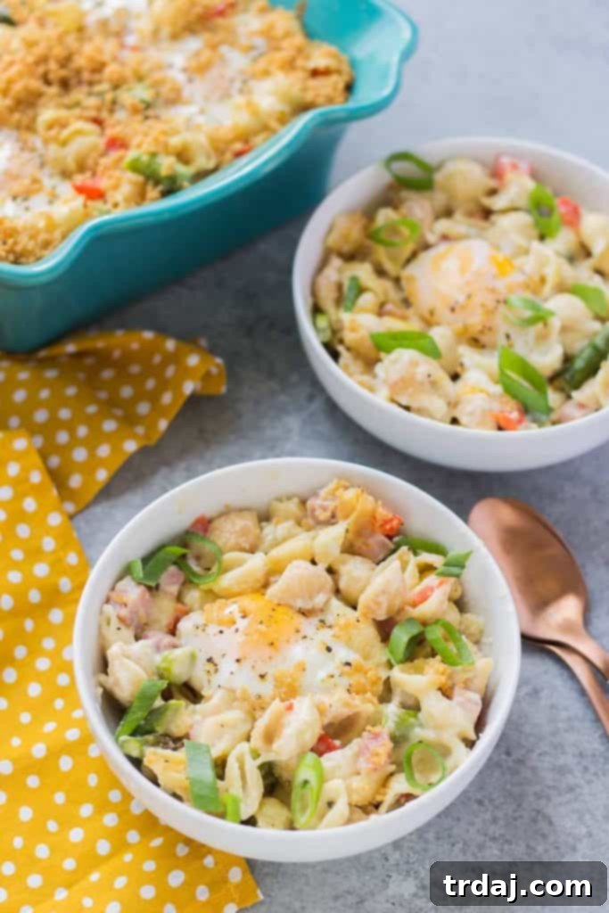 Breakfast Macaroni and Cheese with a focus on the rich, creamy texture and vibrant vegetables.