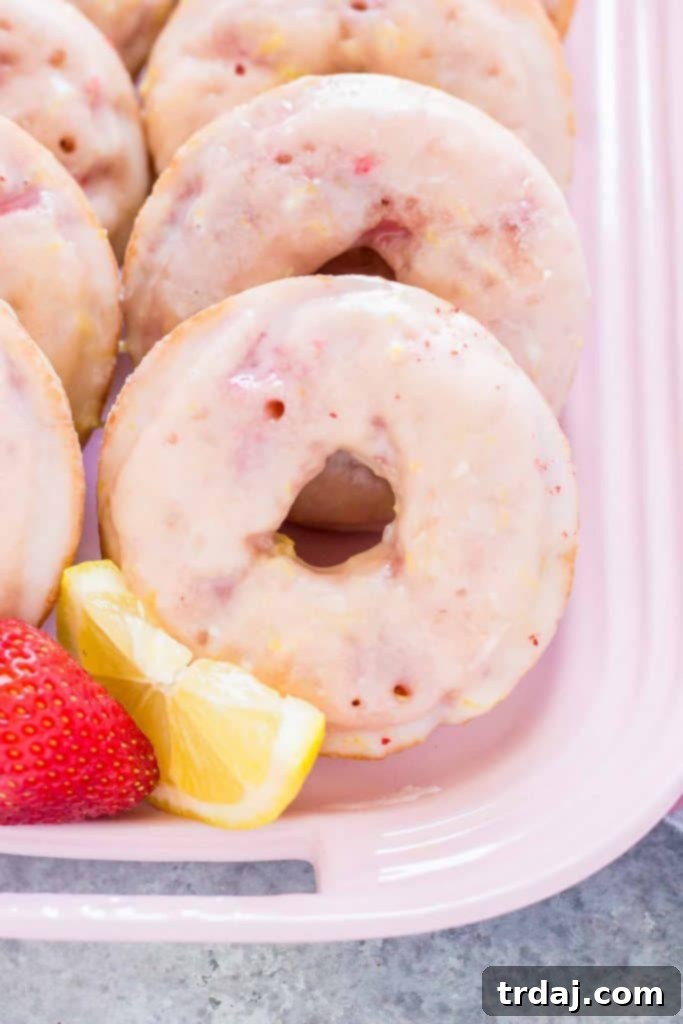 These soft and flavorful Strawberry Lemonade Donuts are a delightful twist on a classic treat. Close-up of Homemade Strawberry Lemonade Donuts on a Cooling Rack
