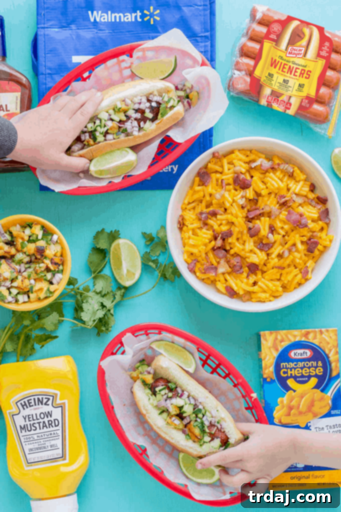 A delicious cookout spread featuring Hawaiian BBQ Hot Dogs and Kraft Macaroni and Cheese
