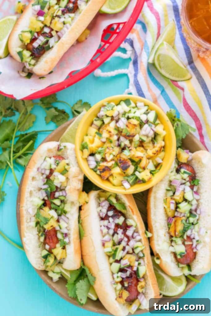 A perfectly grilled Hawaiian BBQ Hot Dog with fresh salsa